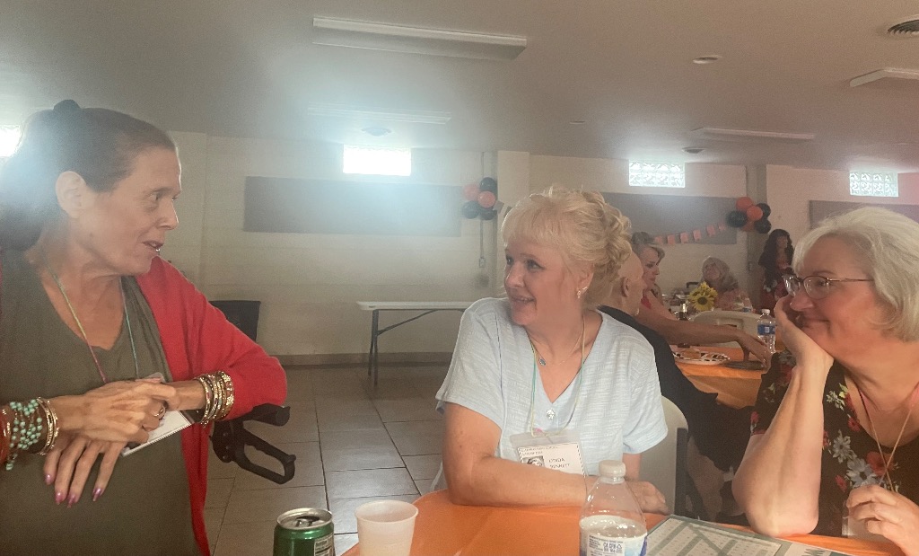 Laura Richendollar Aguilar, Lynnda Bennett Kopach and Norma McDonald Brammer catching up